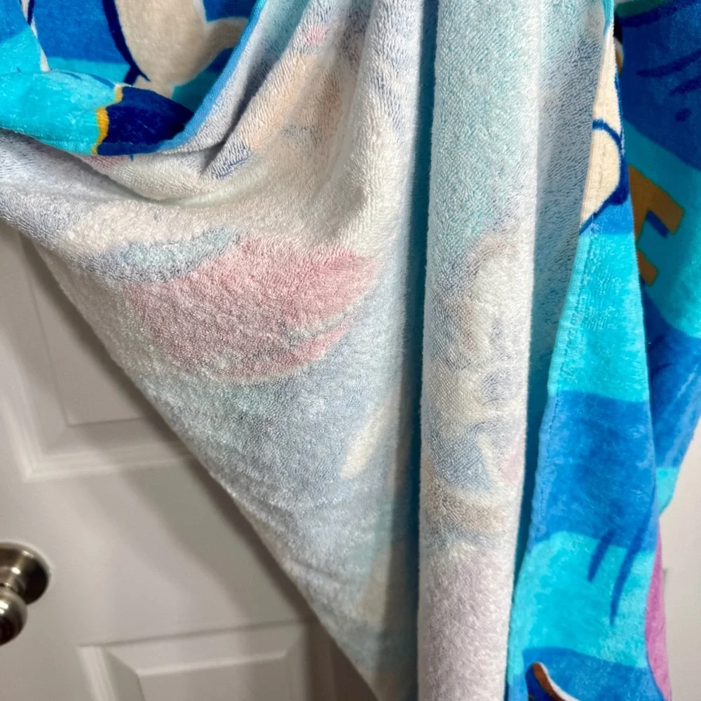 NWT. Disney beach towel featuring Mickey Mouse and others. “FUN IN THE SUN